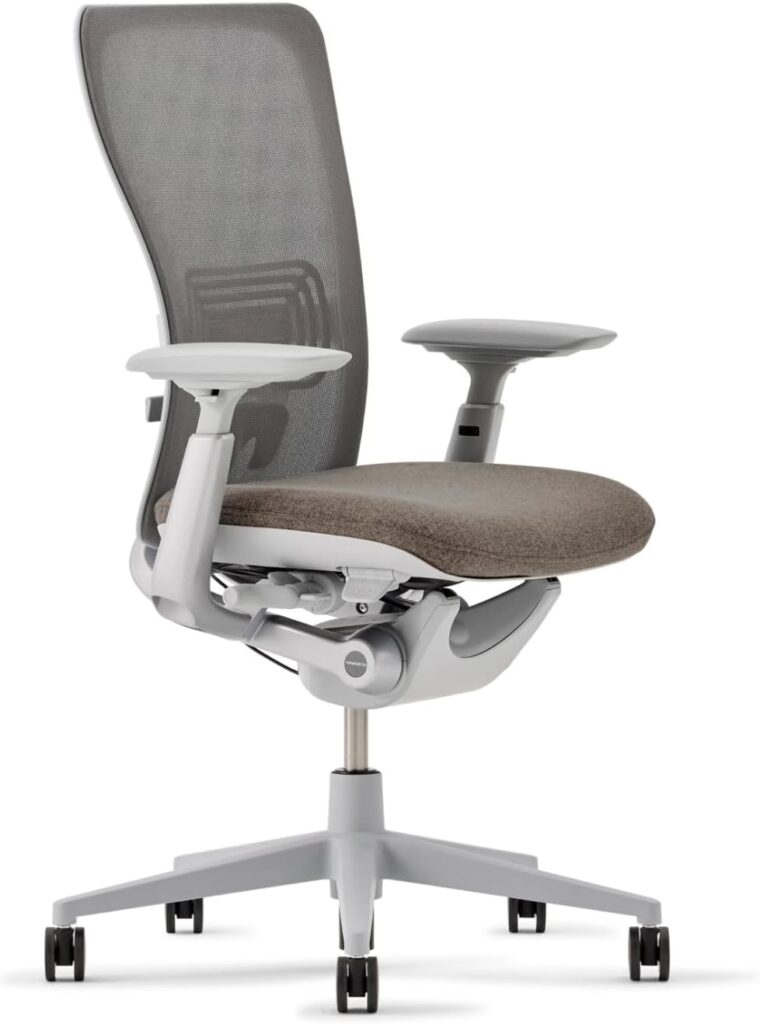 Haworth Zody ergonomic office chair with a light gray mesh backrest and a cushioned seat in a neutral tone.