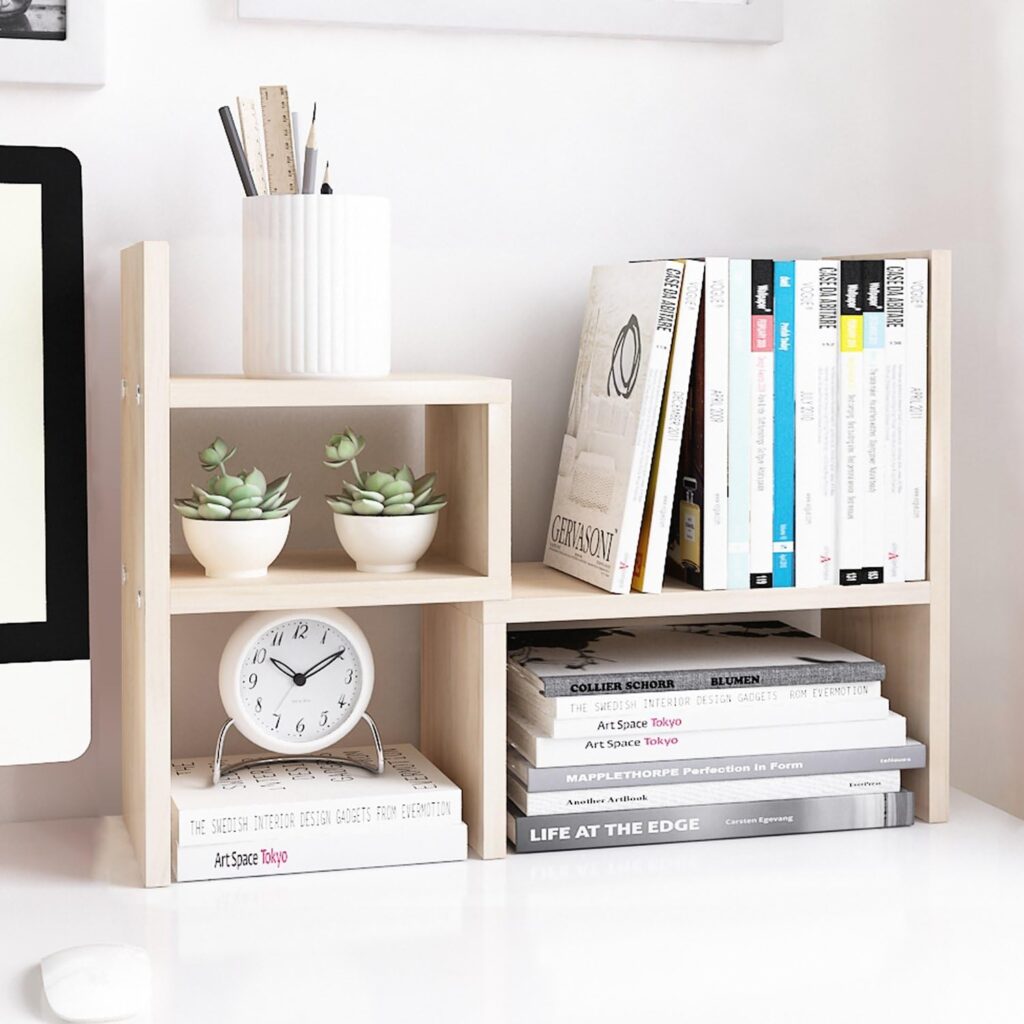 Jerry & Maggie Desktop Organizer featuring adjustable wooden shelves for holding books, small potted plants, and office supplies.