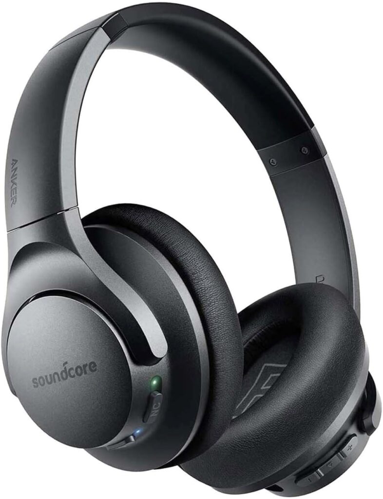 Black over-ear noise-cancelling headphones by Anker, featuring the Soundcore logo on the ear cups. The headphones have a sleek, modern design with padded ear cushions for comfort and a headband that adjusts for a secure fit. The right ear cup has buttons for volume control and playback, as well as an indicator light and a switch for activating noise cancellation.