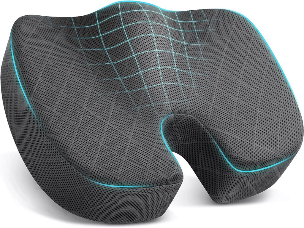 Ergonomic memory foam seat cushion with a contoured design, featuring a breathable mesh cover and blue accents. The surface has a grid pattern for added comfort and ventilation.