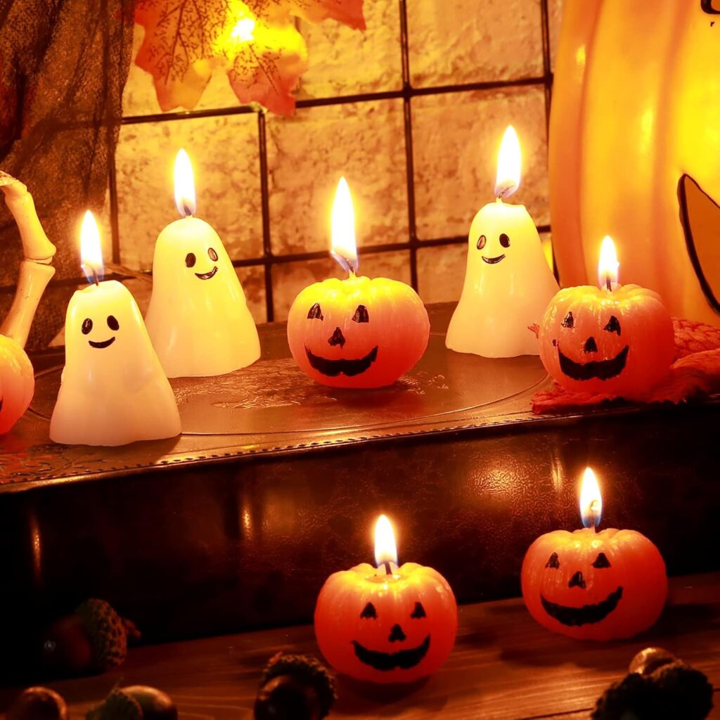 Smiling pumpkin and ghost like candles on a corner of the room.