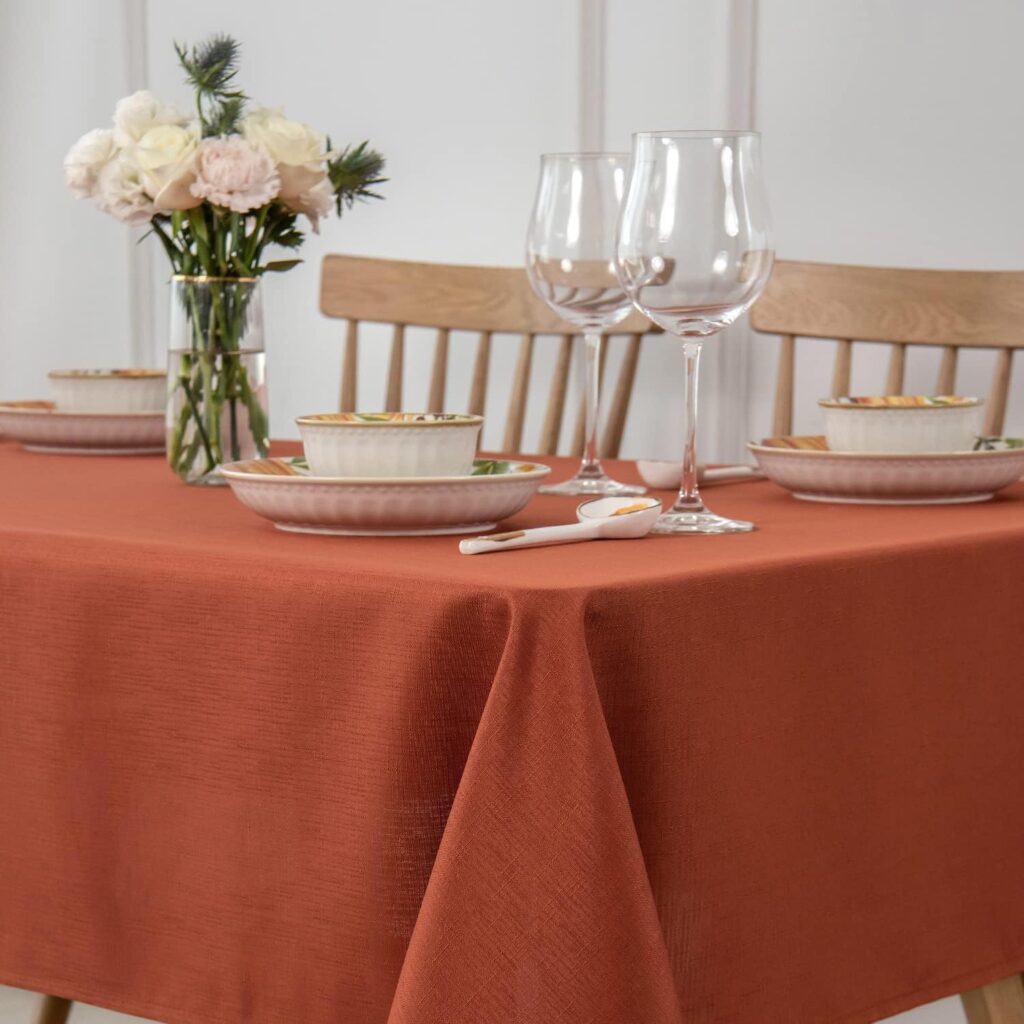 Cozy dining table with an orange tablecloth 